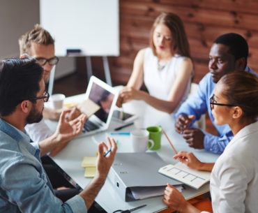 Group of multi-ethnic business partners discussing ideas