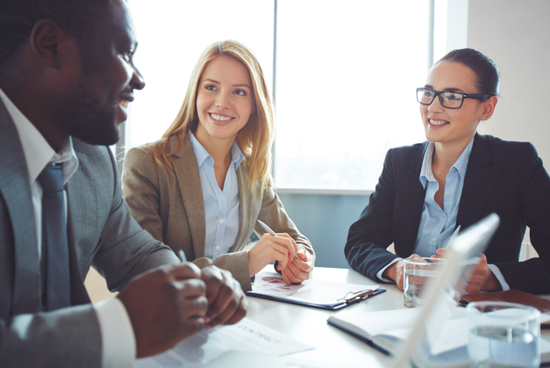 5 tips to make the most of your third-party content business professionals at a boardroom table smiling