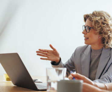 CMO having a discussion at a conference table